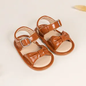 Brown baby sandals with bow decoration and breathable rubber sole for toddlers