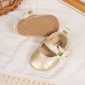 Close-up of baby girl Mary Jane shoes with anti-slip heart soles and size labels