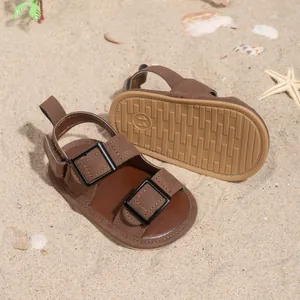 Detail of non-slip rubber sole with size 11 mark on brown baby summer sandals