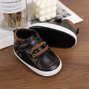 Toddler black faux leather sports shoes with brown trim and anti-slip soft soles