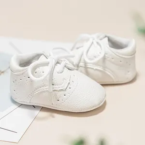 Classic white soft sole baby shoes with brogue perforations for newborns 0-12 months