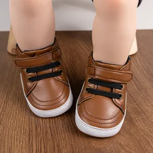 Close-up of brown baby walking shoes featuring synthetic leather and velcro closure