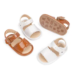 Detail of baby summer sandals showing floral design and non-slip zodiac embossed soles