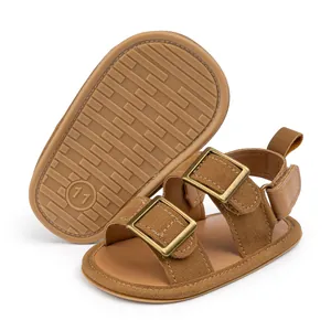 Detail of brown baby sandals with buckled straps and non-slip rubber soles, size 11