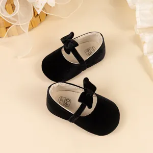 Elegant black velvet baby Mary Jane shoes with bow decoration for infants 0-6 months