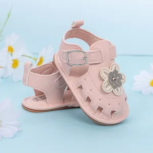 Pink infant sandals with floral design and soft soles for baby girls' summer steps