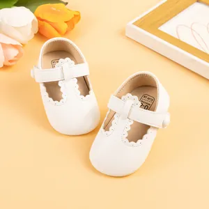 White leather baby Mary Jane shoes with scalloped edges and non-slip soles for toddlers