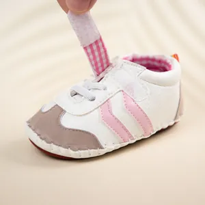 Close-up of baby walking shoes showing the convenient Velcro closure and premium stitching