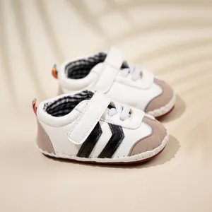Detail of baby sneakers with velcro closure and rainbow heel tab for infants