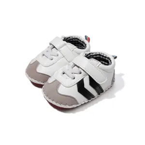 Detail view of baby walker shoes with Velcro strap and suede toe cap for casual comfort