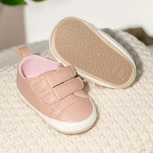Detail view of anti-slip rubber sole with texture and baby shoes velcro closure