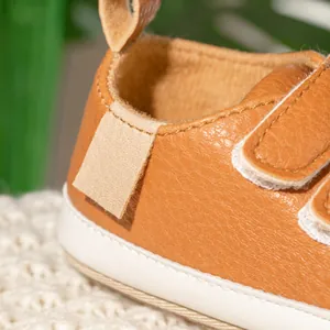 Brown leather baby walking shoes with anti-slip rubber soles and velcro straps