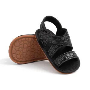 Detailed view of baby woven sandals featuring crisscross straps and anti-slip pebble soles