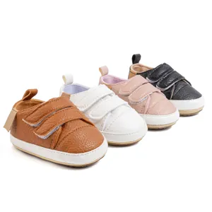 Detail view of four colors of baby walking shoes with texture and double velcro straps