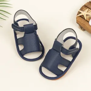 Dark blue baby sandals with velcro straps and lychee texture for summer infants