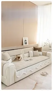 Detailed view of cream chenille sofa cover with elegant wavy edges and woven textures