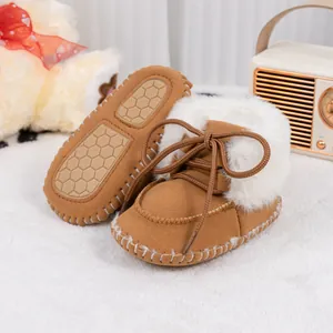 Detail of baby winter boot featuring warm plush lining and non-slip honeycomb rubber sole