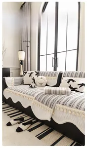 Detailed view of striped chenille sofa cushion with dragonfly pattern and fringe trim