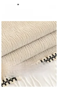Detailed view of beige chenille sofa cover fabric with 3D stripes and braided edge