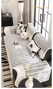 Detail of chenille sofa cover showing 3D striped texture and ivory tassel fringe edges