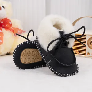 Detailed view of baby winter boots with fluffy faux fur lining and anti-slip honeycomb soles