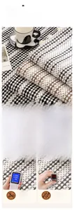 Detail view of eco-friendly chenille sofa cover fabric with textured plaid pattern