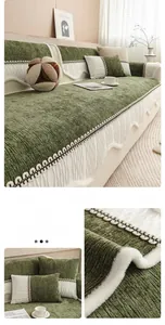 Detail of olive green chenille sofa cover with ribbed texture and white faux fur wave trim