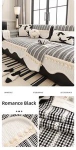 Macro detail of French chenille sofa cover fabric with black love letter pattern and tassels