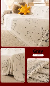 Detail of grey puppy star pattern sofa throw with soft fleece texture and fringe