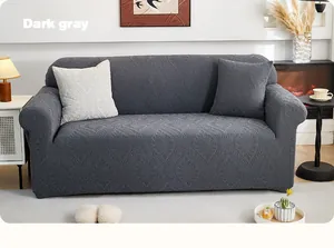 Detail van donkergrijze bankhoes met bladmotief en zeer rekbare gebreide stof