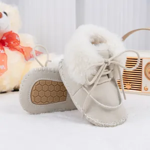 Beige baby winter snow boots with white faux fur collar and anti-slip rubber soles