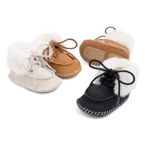 Plush lined baby moccasin boots with soft non-slip soles in white, brown and black