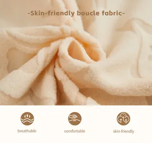 Close-up of skin-friendly beige boucle fabric with soft texture and breathable grain