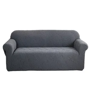 Donkergrijze elastische bankhoes met jacquard bladpatroon op witte achtergrond