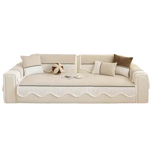Chenille sectional sofa cover with scalloped edges and textured weave in beige