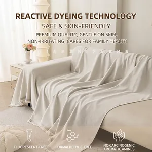 Premium chenille sofa cover with quilted diamond pattern and fringe in home setting