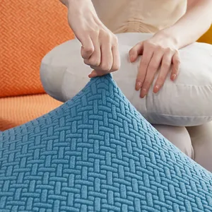 Universal elastic sofa cover in blue fabric with textured stretch material