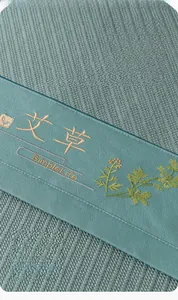 Detail showing ice vine fabric texture with plant embroidery and widened edging