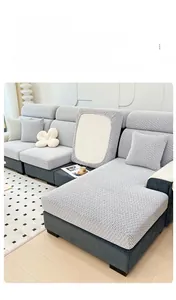 Detailed view of grey herringbone pattern chenille sofa cover with soft knitted texture