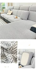 Detail of premium black grey chenille sofa cover with woven herringbone pattern