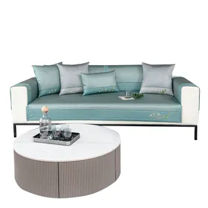 Green ice silk sofa mat with embroidery detail and matching pillows in a home setting