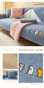 Detail of lamb wool sofa cover with anti-slip backing and cute gesture embroidery