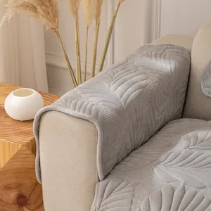Thick light grey plush sofa cover with elegant leaf quilted pattern for home protection