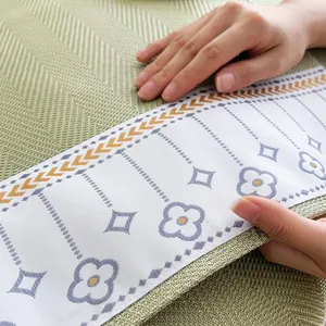 Summer ice silk sofa mat with light green herringbone weave and floral pattern