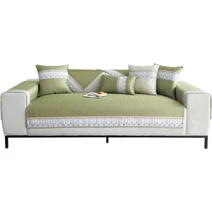 Ice silk cooling sofa mat set in grass green with geometric patterns and pillows