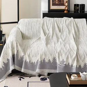 Nordic pine forest pattern sofa cover with tassels in off-white knitted fabric