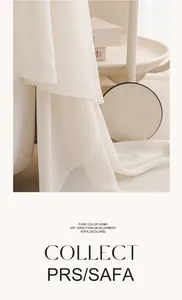 Détail du jeté de canapé en tissu léger crème avec textures de jupe en dentelle délicate