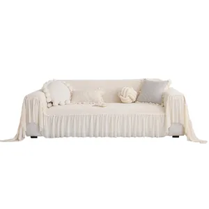 Housse de canapé blanc crème avec jupe à volants élégante et tissu en maille texturée