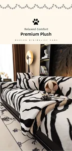 Detail of plush zebra print sofa cover and cushion made of thick faux rabbit fur fabric