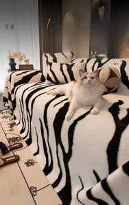 Close-up detail of plush zebra print sofa cover made of warm faux rabbit fur material